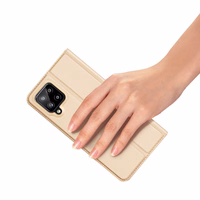 Dux Ducis Skin Pro raamaturiiuli tüüpi ümbris Samsung Galaxy A22 4G jaoks kuldne
