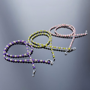 A chain for glasses, beads, an orange pendant