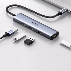 Adapter Ugreen 2-in-1 hõbedane (sisend: Type-C / väljund: 4-USB)