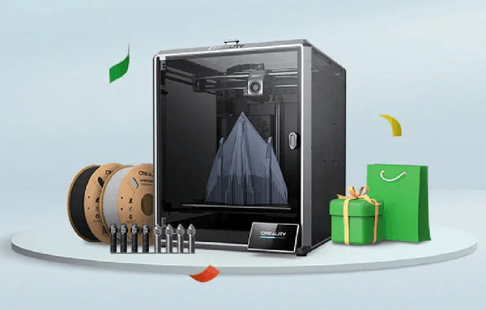 3D-printer sinise mudeliga filamentide, tööriistade ja roheliste kingituste keskel