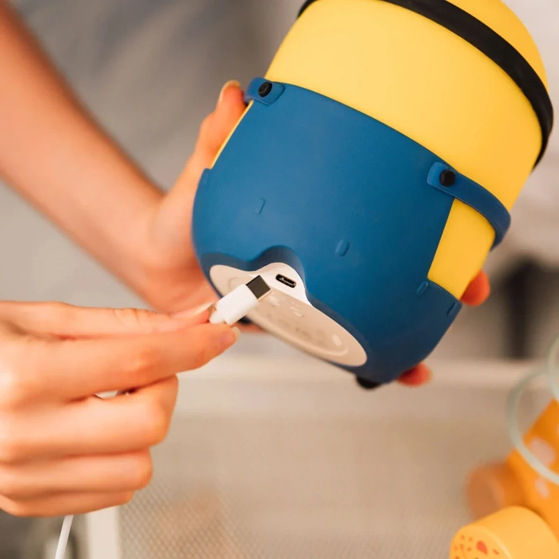 USB-C cable being connected to the port on the Minions Bob lamp